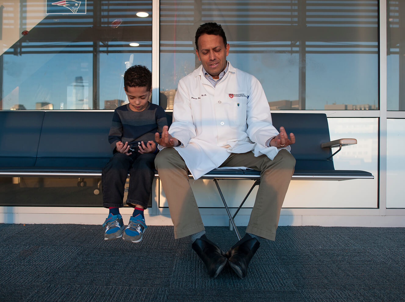 Florian Eichler, MD, teaches one of his young ALD patients to meditate.