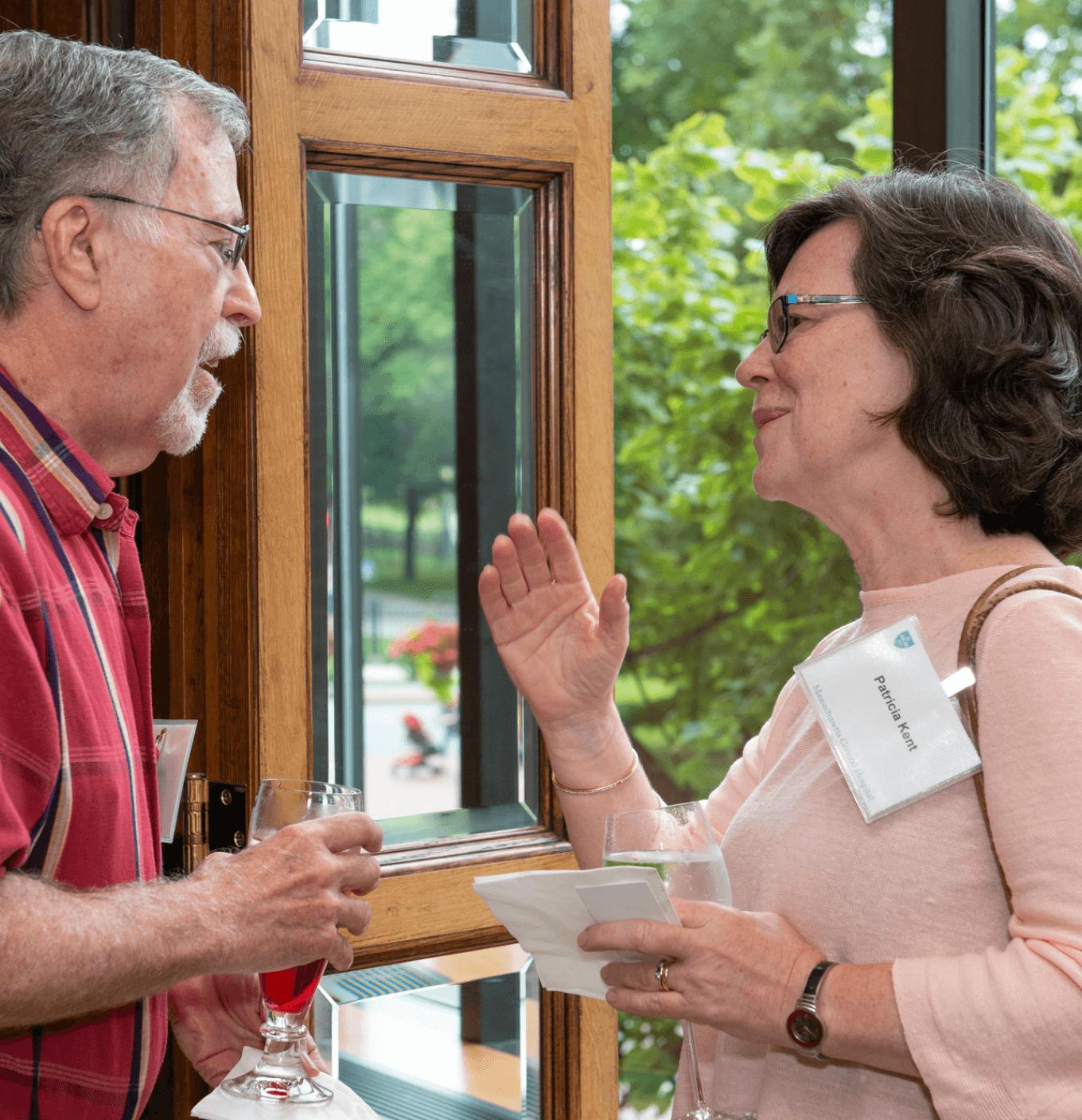 Two people talking in a doorway