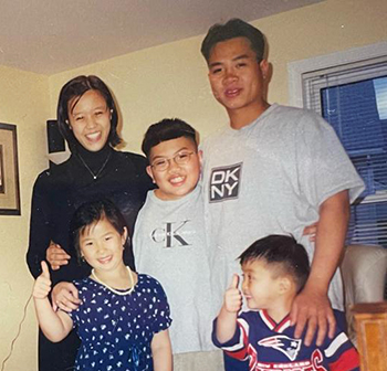 L-R: Quyen (Scott's wife), Chau (Viet's sister), Jeff (Scott's brother), Scott and Viet, at his childhood home in Medford, Mass.