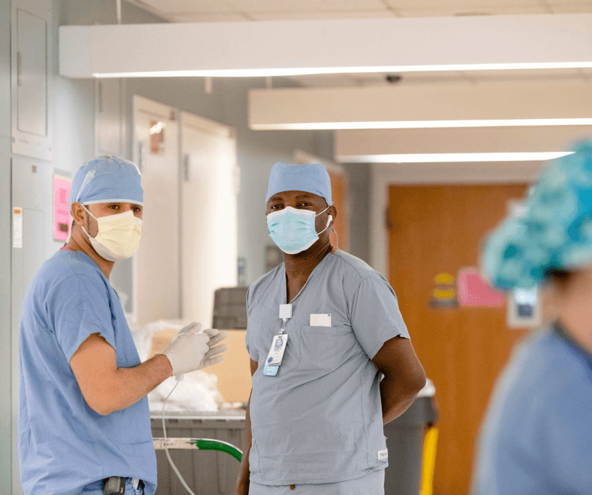 Two doctors talking in hospital hallway